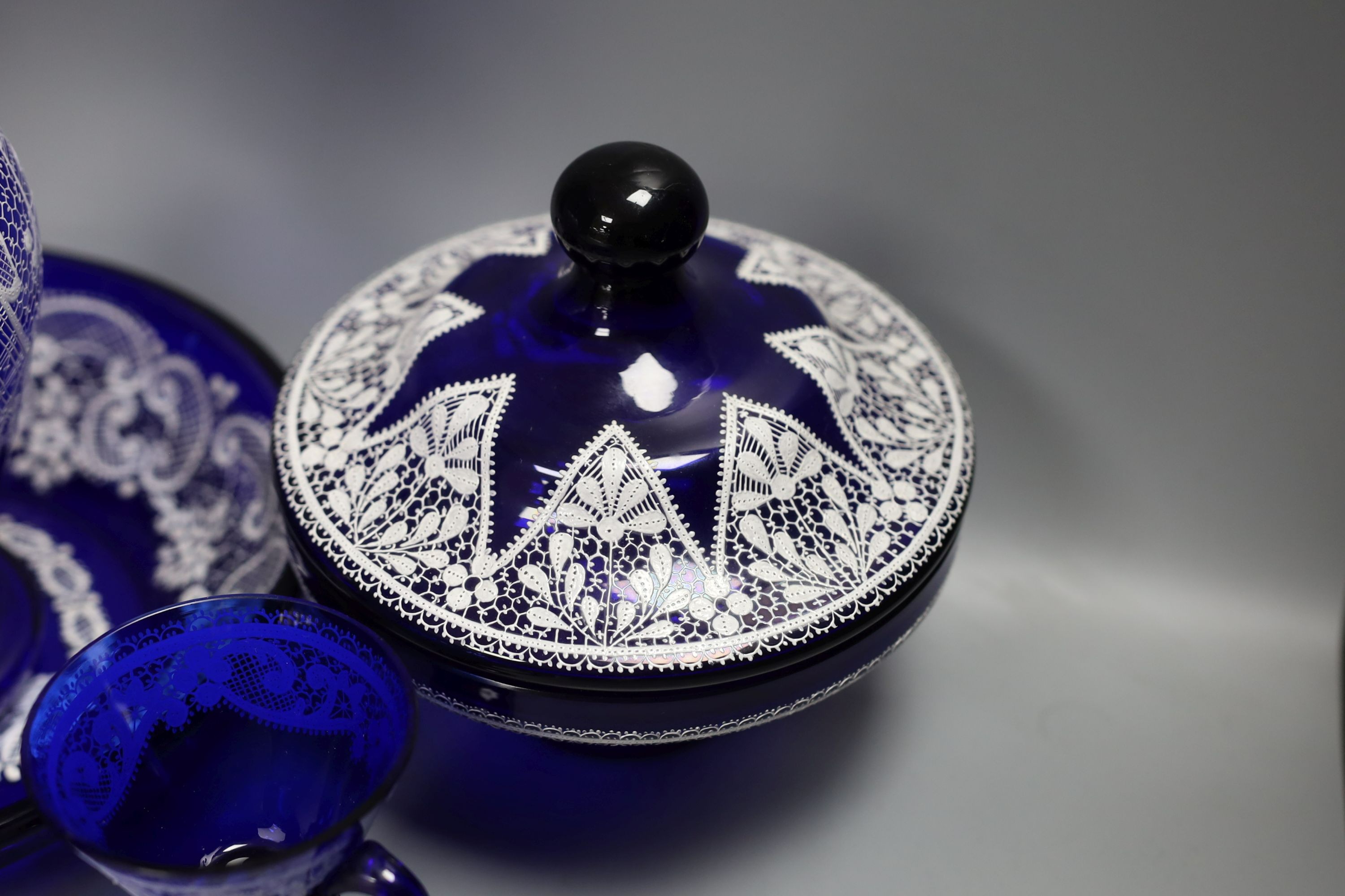 A group of Venetian Lace pattern enamelled blue glass, including a goblet, a vase etc (7)